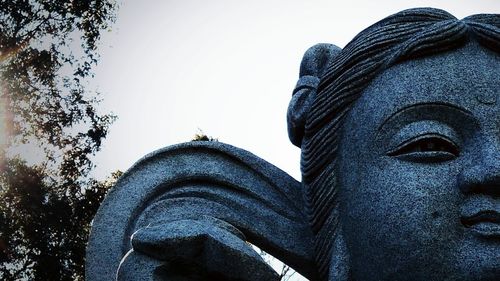 Low angle view of statue against sky