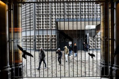 People standing in corridor of building