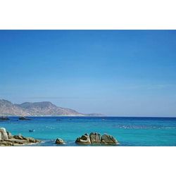 Scenic view of sea against blue sky