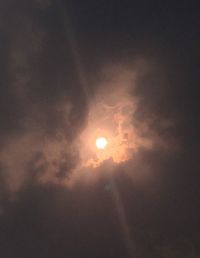 Low angle view of moon at sunset