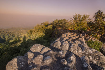 Scenic view of rocks on landscape against sky