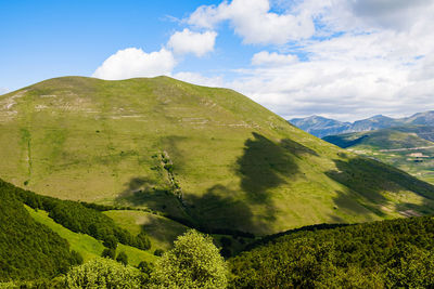 Scenic view of landscape against sky in castelluccio, umbria 