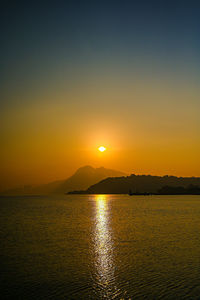 Scenic view of sea against sky during sunset