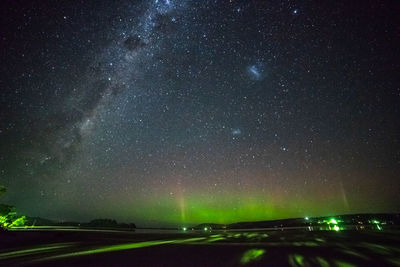 Scenic view of road against sky at night