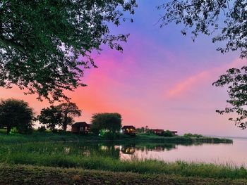 Scenic view of field against sky during sunset