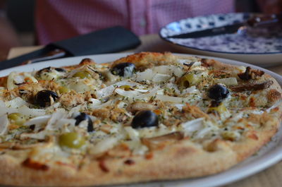 Close-up of pizza in plate on table