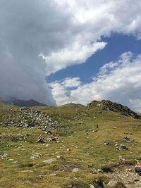 Scenic view of landscape against cloudy sky