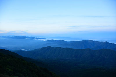 View of mountain range against cloudy sky