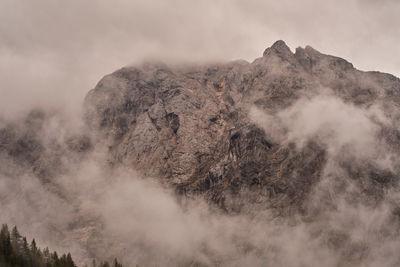 Smoke emitting from volcanic mountain against sky