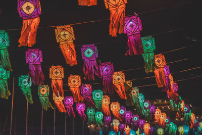 Low angle view of illuminated lanterns hanging at shop