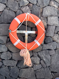 High angle view of orange hanging on wall