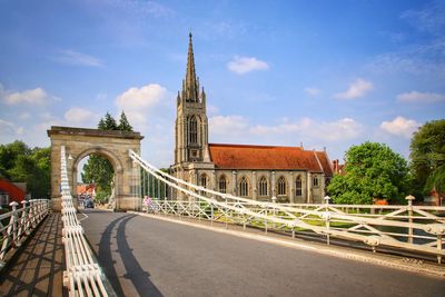 View of bridge against cloudy sky