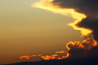 Low angle view of dramatic sky during sunset