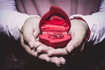 Close-up of hands holding heart shape