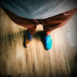 Low section of man standing on floor