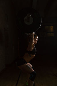 Woman preparing for weightlifting