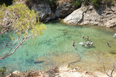 High angle view of people swimming in river