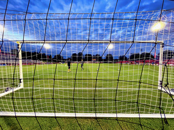 Scenic view of soccer field against sky