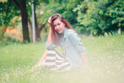 Portrait of beautiful woman on field