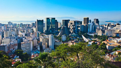 View of cityscape against blue sky