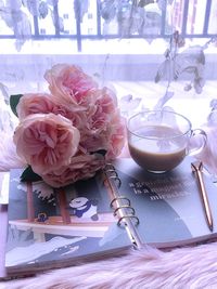 Close-up of roses in vase on table