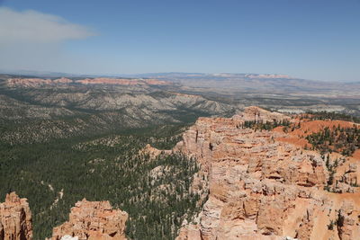 Aerial view of landscape with mountain range in background