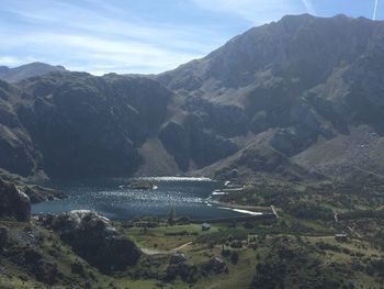 Scenic view of bay against mountains