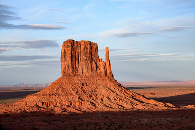 Rock formations on landscape against sky