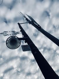 Low angle view of street light against sky