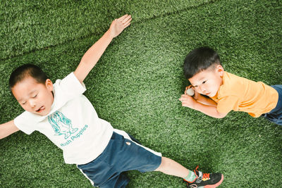 High angle view of boy standing on road