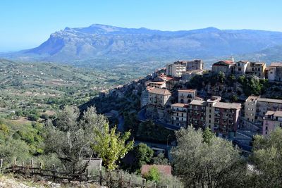 High angle view of houses against mountains