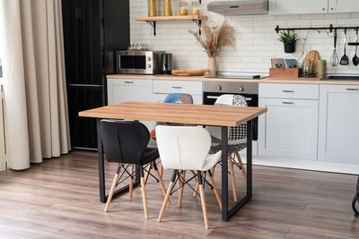 Interior of kitchen in rustic style with vintage kitchen ware and wooden wall