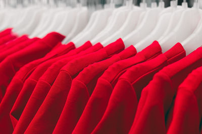 Close-up of red clothes hanging on chair