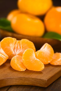 Close-up of orange slices on cutting board