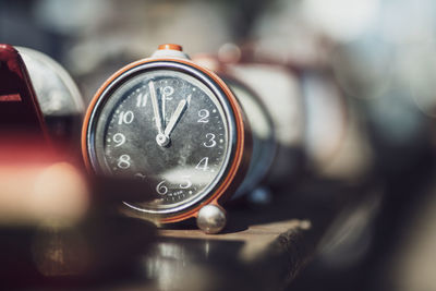 Close-up of alarm clock on table