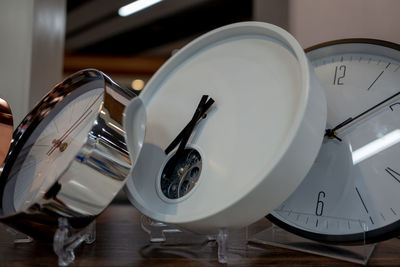 Close-up of clocks on table