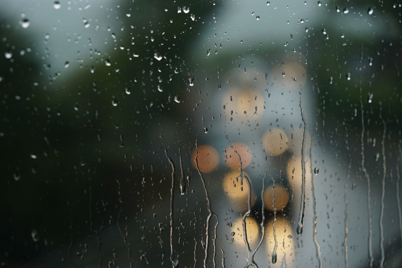 RAINDROPS ON GLASS WINDOW