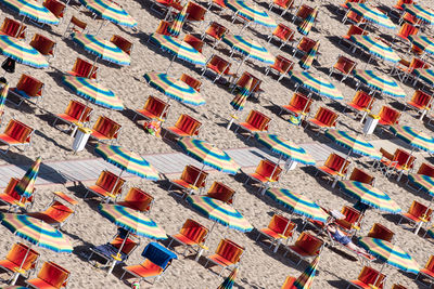 Some sunbeds and umbrellas at the beach on the adriatic riviera in italy