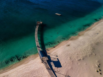 High angle view of sunglasses on beach