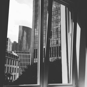 Modern cityscape seen through window