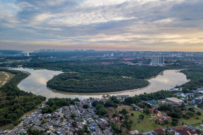 High angle view of river amidst buildings in city