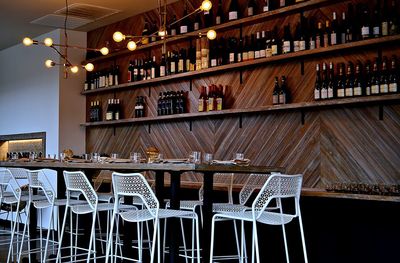 View of empty chairs and tables in restaurant