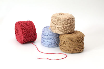 Close-up of multi colored pencils over white background