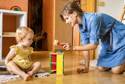 Women sitting on floor at home