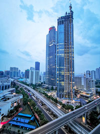 High angle view of buildings in city against sky