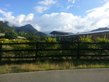 Scenic view of mountains against cloudy sky