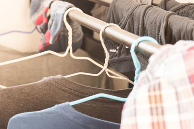 Close-up of coathangers on rack