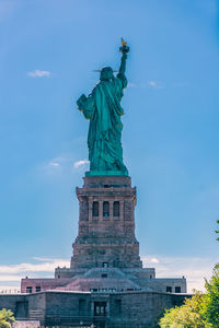 Low angle view of statue against sky