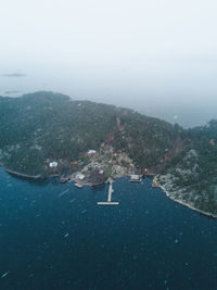 Aerial view of brännskär guest harbor in snow