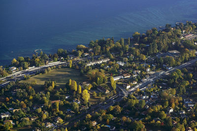 High angle view of buildings by sea